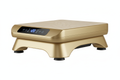 a gold coloured vibration plate exercise machine